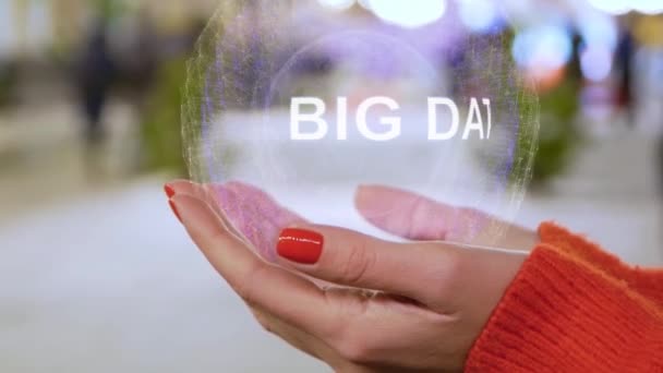 Female hands holding a conceptual hologram Big Data — Stock Video