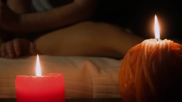 Two candles in spa center on professional massage — Stock Video