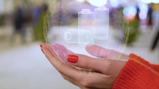 Vrouwelijke handen Holding hologram oplaadbare batterijen — Stockvideo