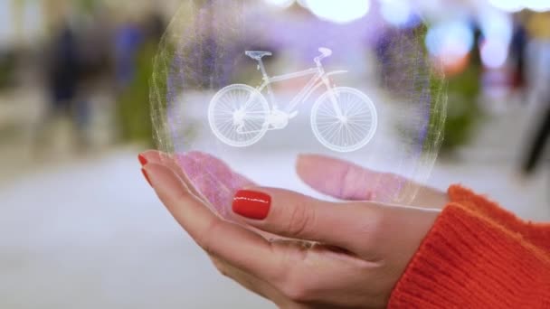 Ženské ruce držící holografický moderní horský bicykl — Stock video