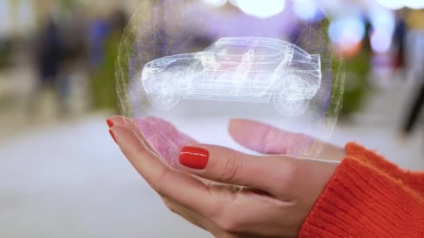 Mains femelles retenant le SUV moderne d’hologramme — Video