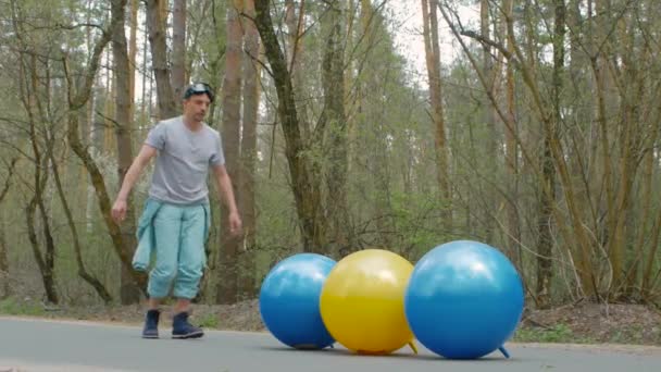 Young man in blue suit in the forest — Stock Video