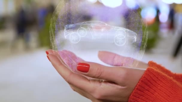 Main féminine tenant hologramme voiture de course moderne — Video