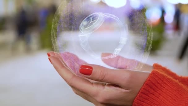 Manos femeninas sosteniendo reloj de pulsera holograma — Vídeo de stock