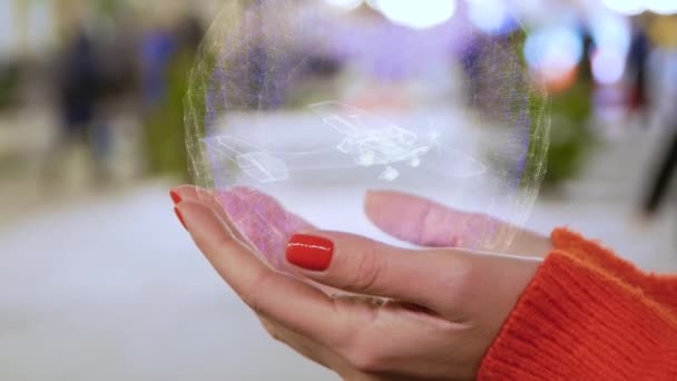 Mains féminines tenant un avion hélice hologramme — Video