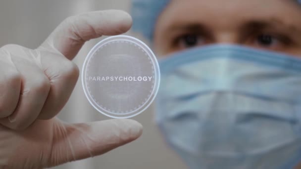 Doctor looks at hologram with Parapsychology — Stock Video