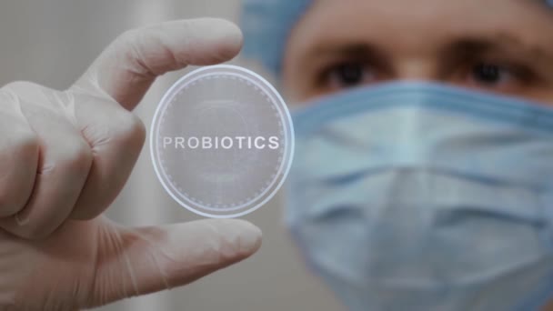 Doctor looks at hologram with Probiotics — Stock Video