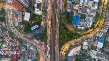 Cityscape aerial view timelapse at night bangkok, Busy traffic across main road at rush hour thailand.