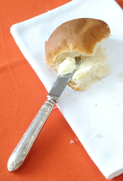 Top View Butter Spread Bun Orange Background Vertical — Stock Photo, Image