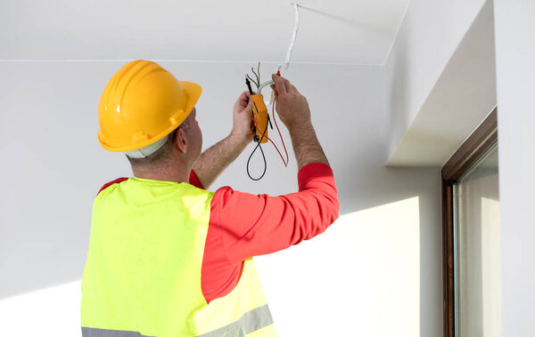 repair of electrical installations, repair of electrical installations, electrician at work