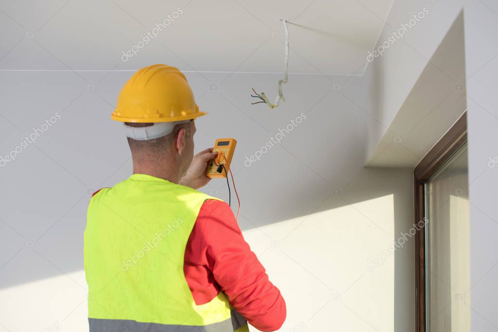 repair of electrical installations, repair of electrical installations, electrician at work