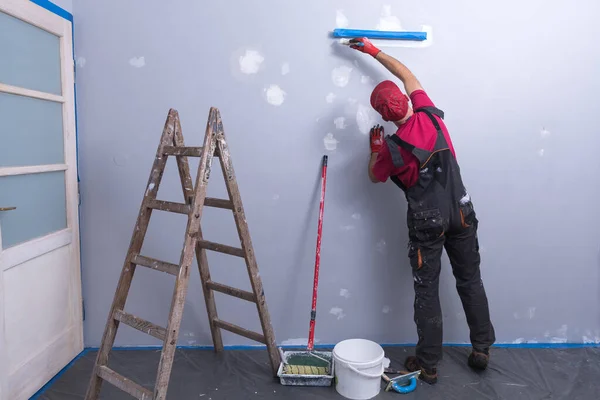 House Painting Business, Tradesman painting a wall — Stock Photo, Image