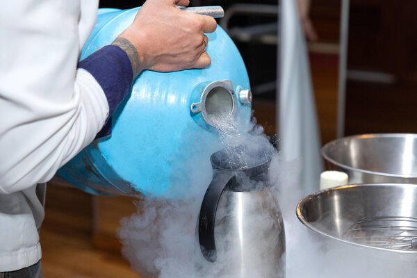 Chef is cooking ice cream with liquid nitrogen