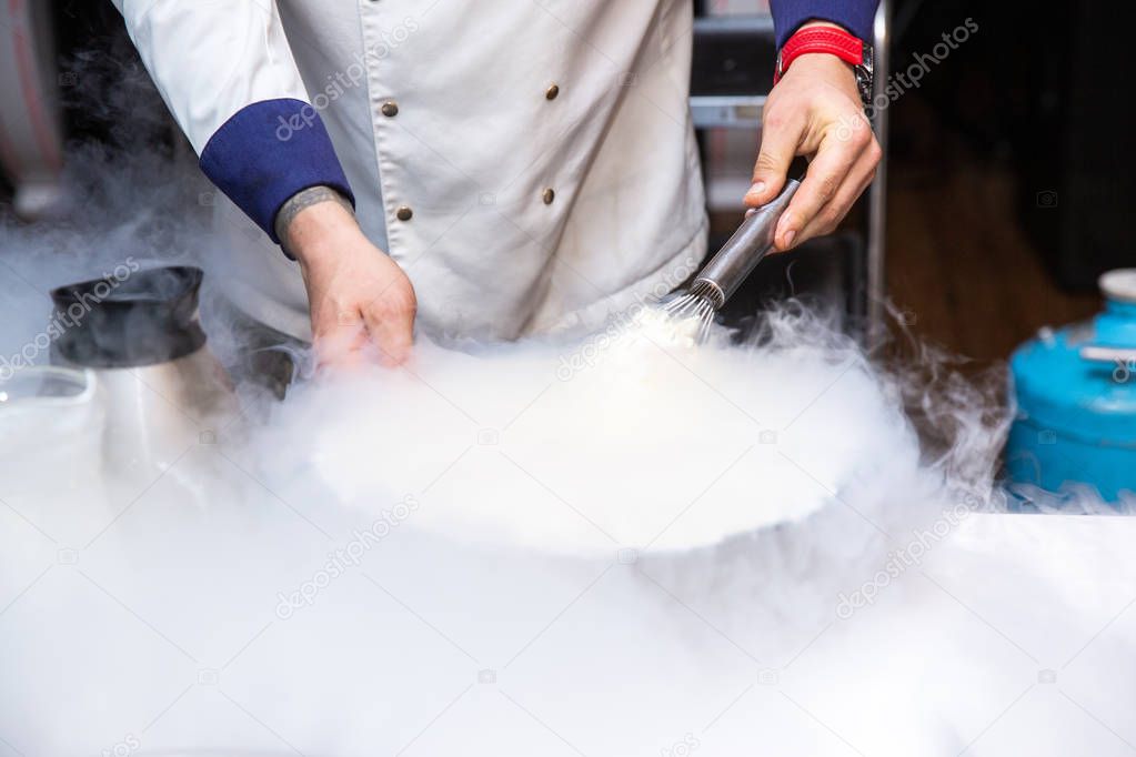 Chef is cooking ice cream with liquid nitrogen