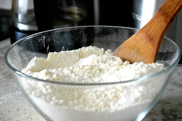 whisking eggs in a bowl with a whisk