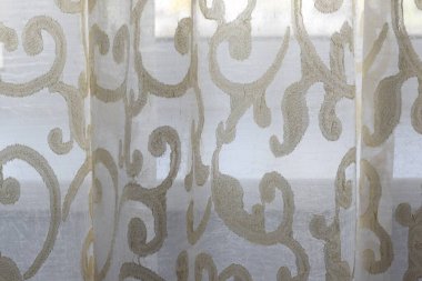 transparent fabric with a pattern on the window