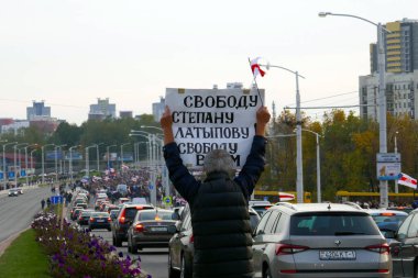 Minsk, Belarus - October 04, 2020. March for the release of political prisoners. Protesters took to the streets of Minsk with placards and flags. clipart