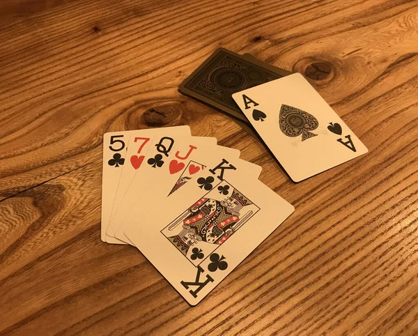 Playing cards on wooden table. Poker