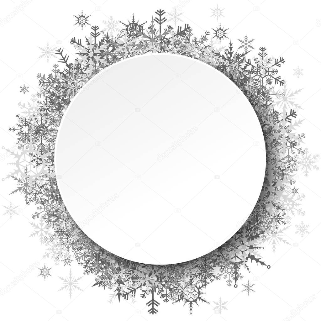 silver snowflakes behind empty round frame for christmas winter greetings on white background