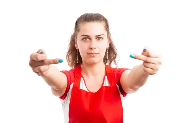 Young female retail worker making vulgar sign as supermarket employee showing middle finger concept isolated on white background