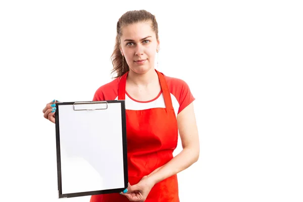 Young Female Supermarket Retail Employee Presenting Empty Clipboard Showing Blank Royalty Free Stock Images