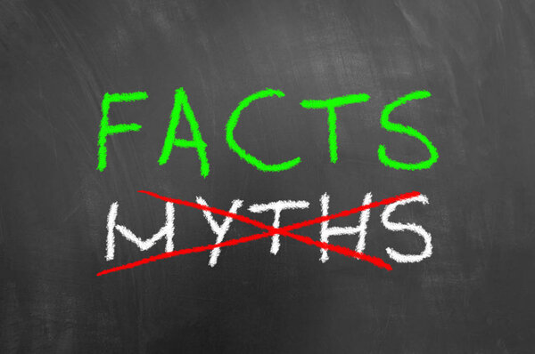 Facts and crossed myths text on blackboard or chalkboard make with white green and red chalk as truth information accuracy concept