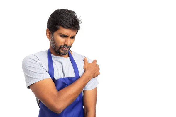 Indian hypermarket or supermarket employee touching injured shoulder with hand isolated on white studio background