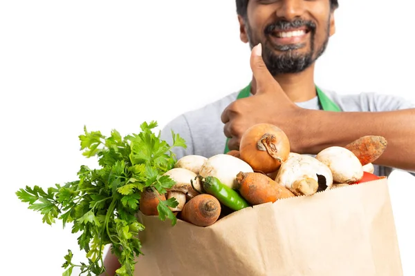 Hypermarket Supermarket Indian Male Employee Holding Paper Bag Vegetables Focused — Stock Photo, Image
