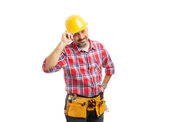 尊敬的建设者触摸黄色安全安全帽与手作为问候概念查出在白色工作室背景 — 图库照片