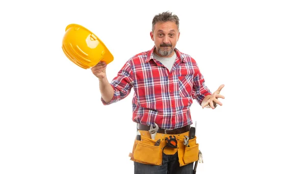 Constructor Con Expresión Cuestionadora Quitando Sombrero Amarillo Con Mano Aislada — Foto de Stock
