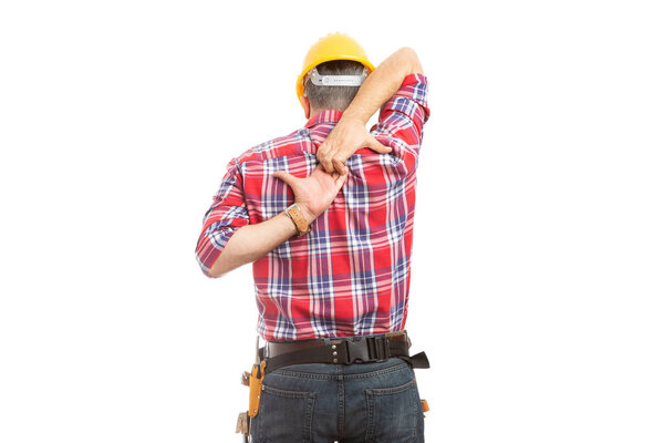 Constructor stretching with hands behind back as warm up for physical effort isolated on white