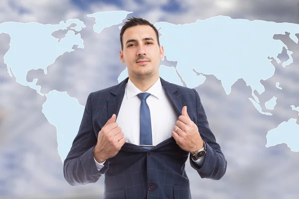 Hero-shot of male broker holding suit open showing tie in front of blue world map background
