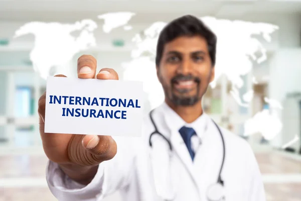 Selective focus image of doctor presenting international insuran — Stock Photo, Image