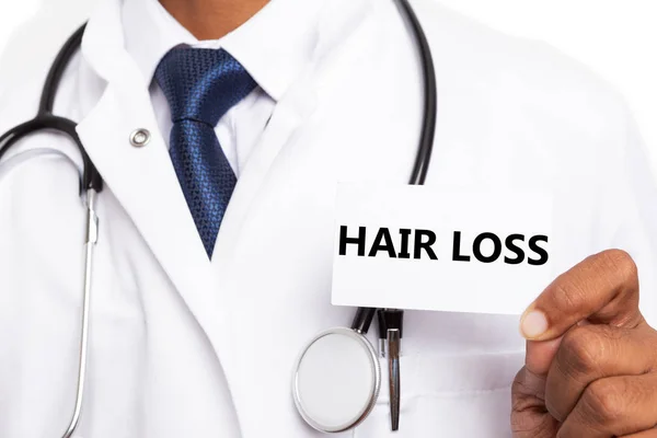 Texto de perda de cabelo no cartão apresentado por docto — Fotografia de Stock