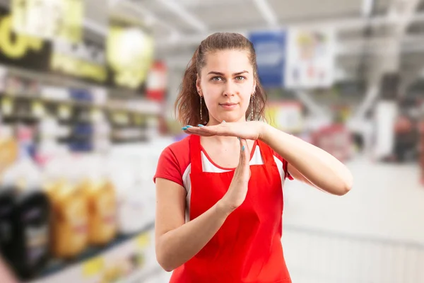 Supermarket worker making time out gestur — Stock Photo, Image