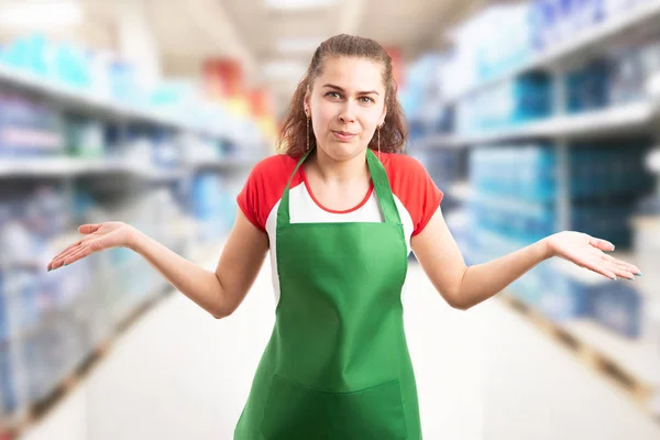 Hypermarket employee making confused gesture and expressio — Stock Photo, Image