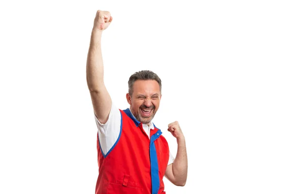 Supermarket employee with arms raised as excited gestur