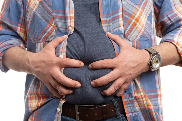 Closeup of bloated man touching belly — Stok Foto