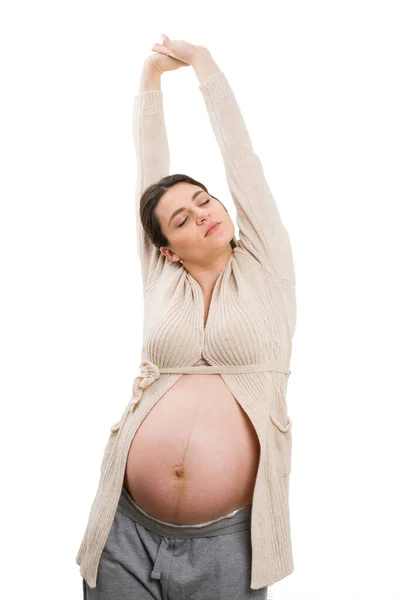 Νεαρή Έγκυος Γυναίκα Που Εκτείνεται Απομονωμένη Λευκό Φόντο Στούντιο — Φωτογραφία Αρχείου