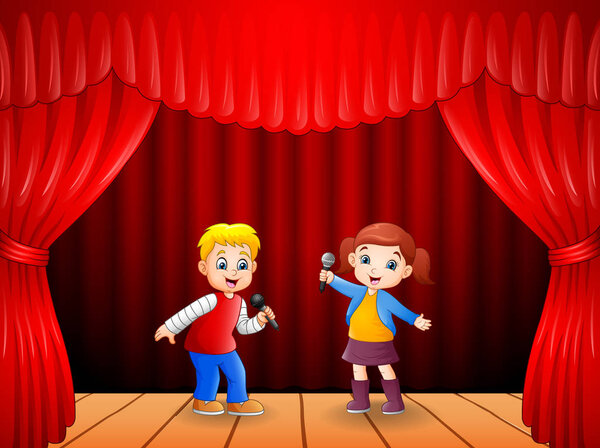 Little boy and girl singing with microphone in his hand