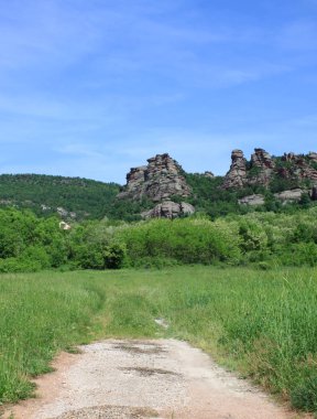 Belogradchik rock heykeller, Bulgaristan Belogradchik şehir yakınında, taşlar. İnsanlar, hayvanlar, kaleler, piramitler veya nesneye benzeyen rock rakamlar grupları içerdikleri.