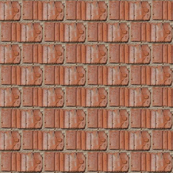 Seamless pattern for artists or designers of red brick wall with fragment of ciment and little stones between tiles