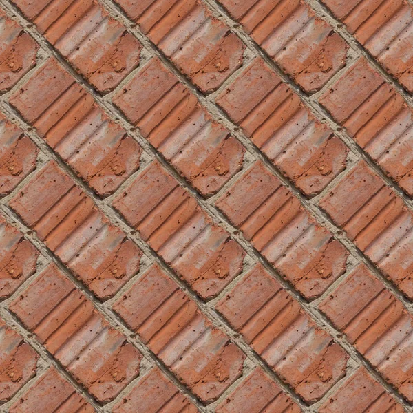 Seamless pattern for artists or designers of red brick wall with fragment of ciment and little stones between tiles