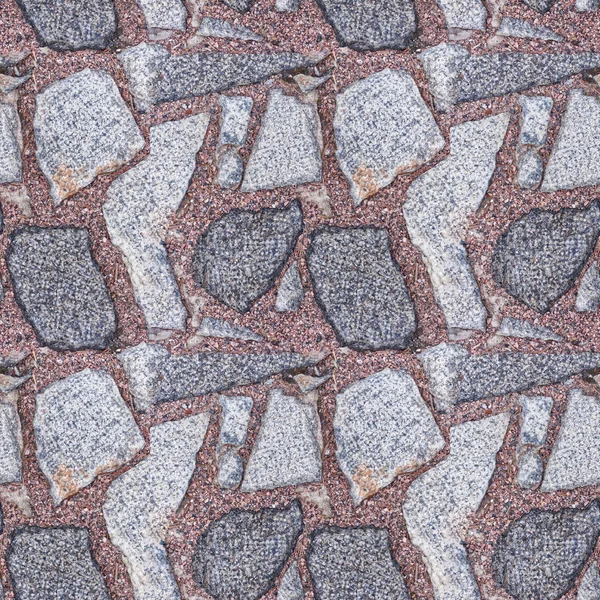 Bezešvé fotografické schéma fragmentu kamenné dlažby s červenými žulovými čipy. Tato dlaždice může být použita k navrhování silnic pro reklamy nebo hry. Vysoce kvalitní textura. — Stock fotografie
