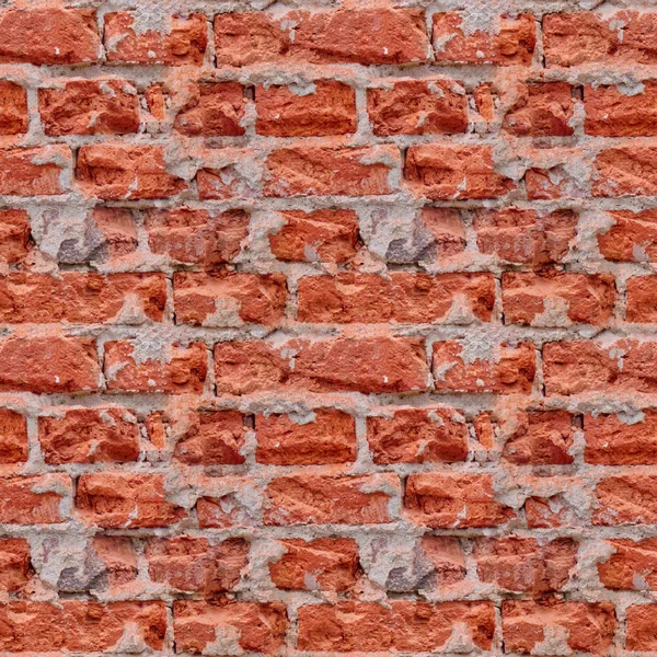 Seamless photo pattern of red broken bricks wall.
