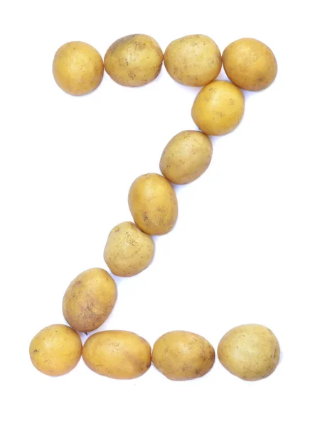 Stock image Letter Z of the English alphabet from potatoes. A letter made of fruit on a white background.