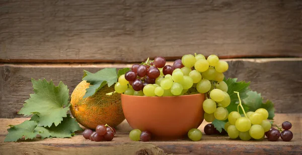Still Life Grapes Melon Wooden Background — Stock Photo, Image