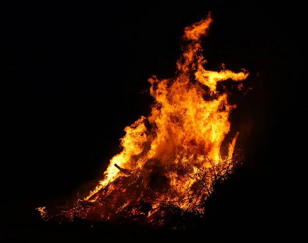 Large bonfire, burning and glowing with soft flames, sparkles fl