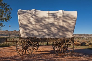 A Pioneer Covered Wagon displayed at Escalante Heritage Center clipart