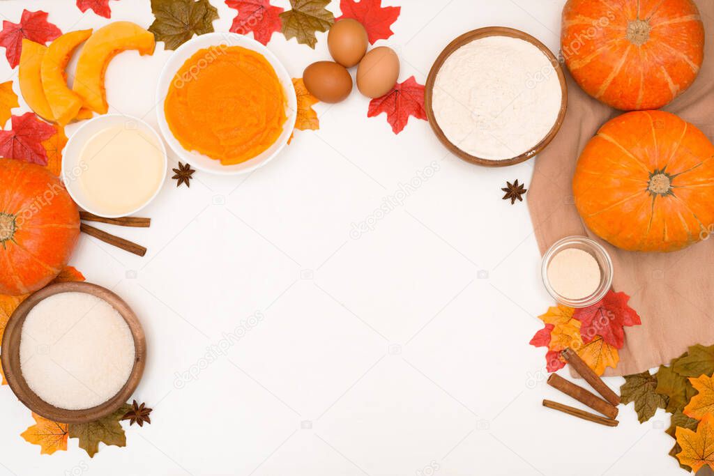 recipe and ingredients for cooking autumn pumpkin cupcakes . top view on a light background